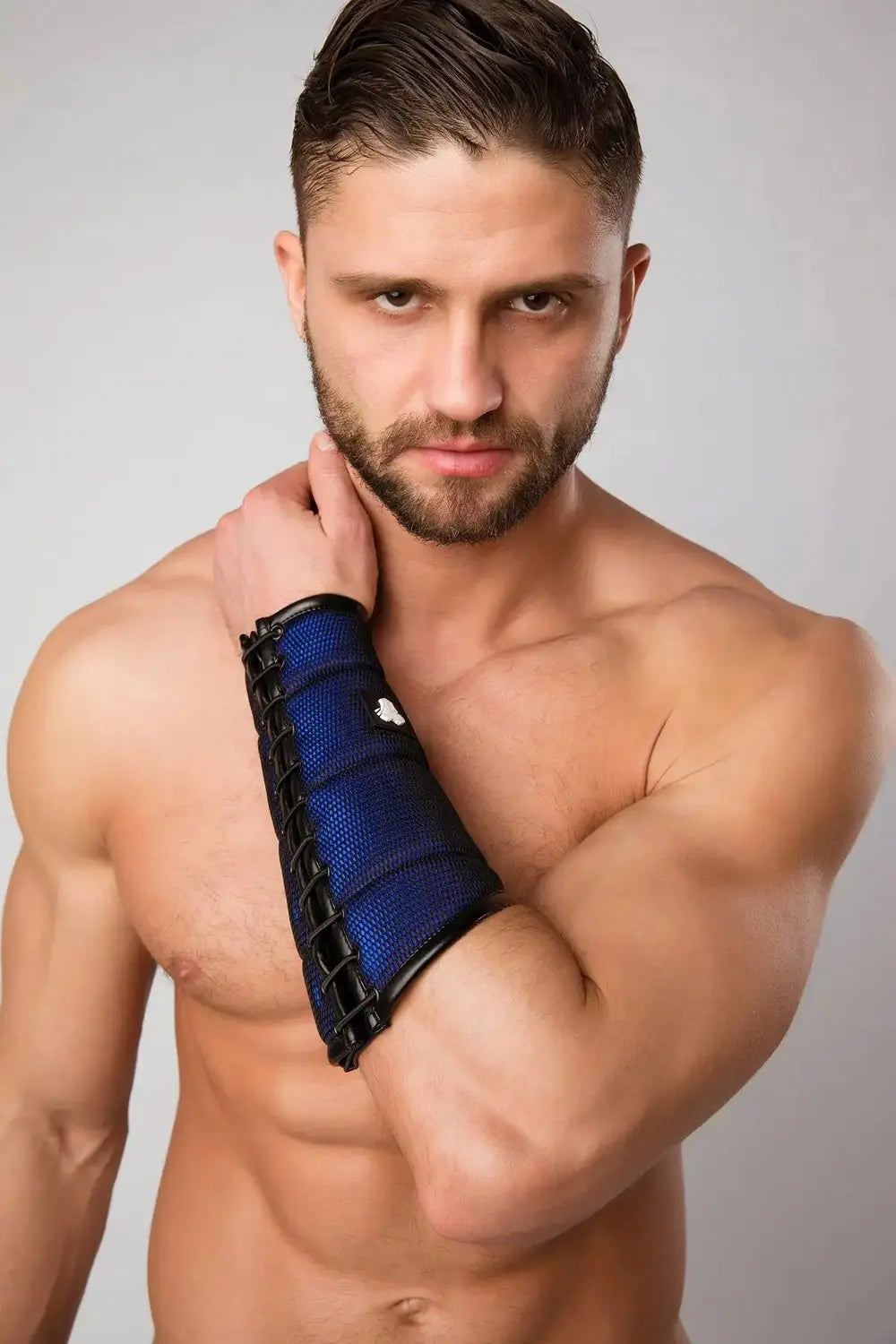 Maskulo Armored Color-Under royal blue forearm guard wallet for men, featuring black mesh and shiny PU leather accents, and a hidden zipper pocket