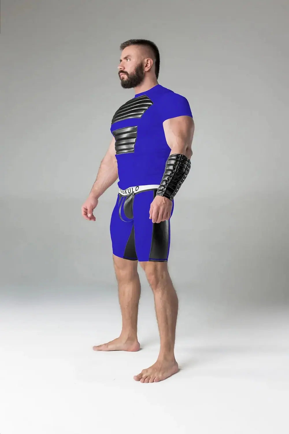 Maskulo Armored Standard blue-royal padded fetish top for men, featuring chest muscle pads and styled for Gen Z urban and gender-fluid wear