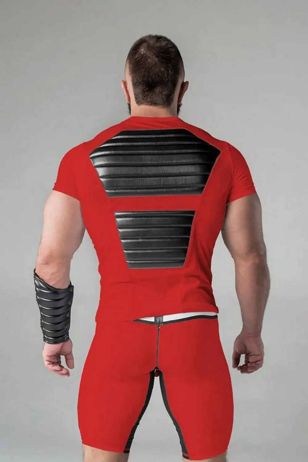 Maskulo red Armored Standard Fetish Top for men with black shiny PU leather chest muscle pads, ideal for fitness and international party-goers