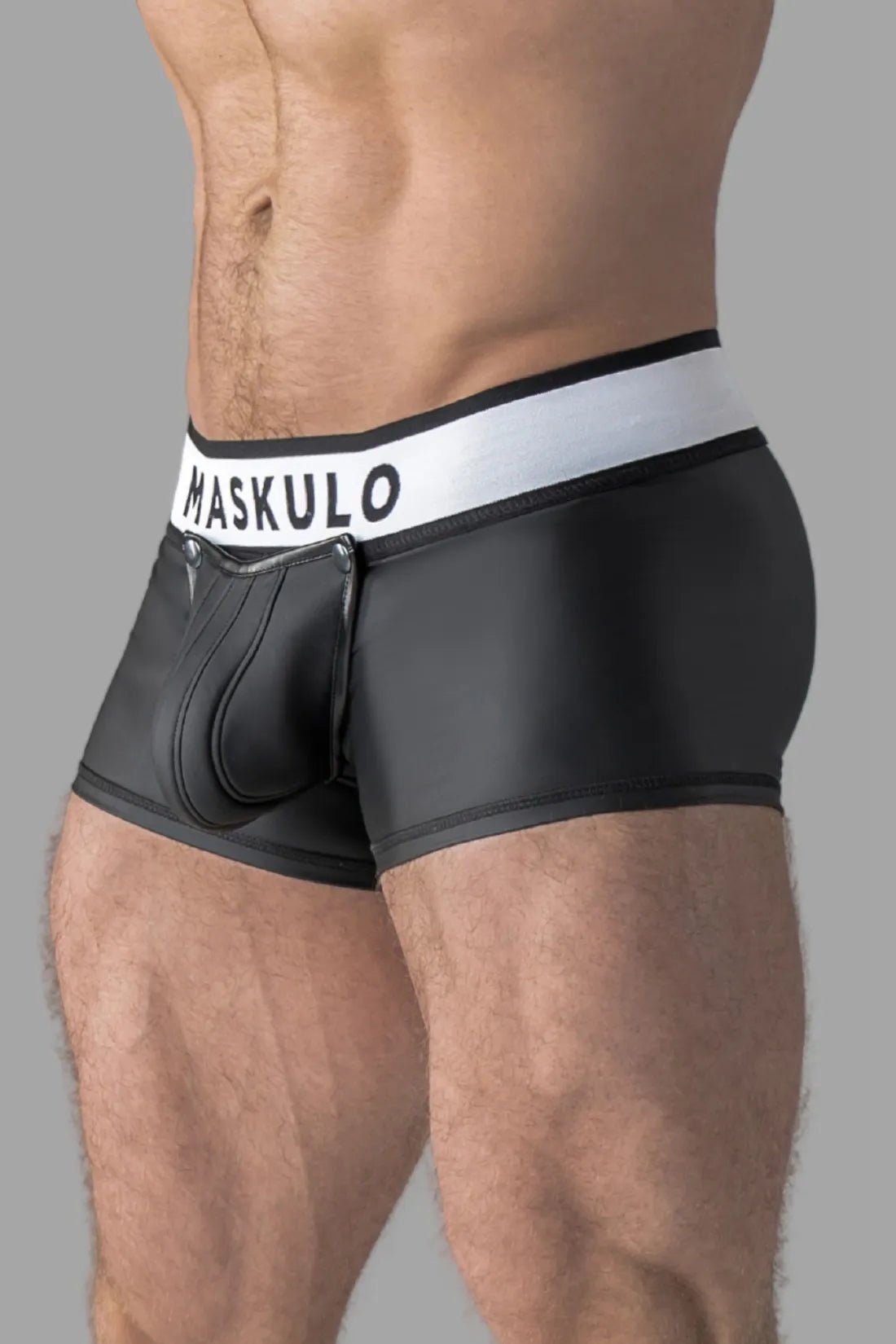 Black rubber-look trunks with detachable pouch and open rear from Maskulo. Male adult underwear accessory.
